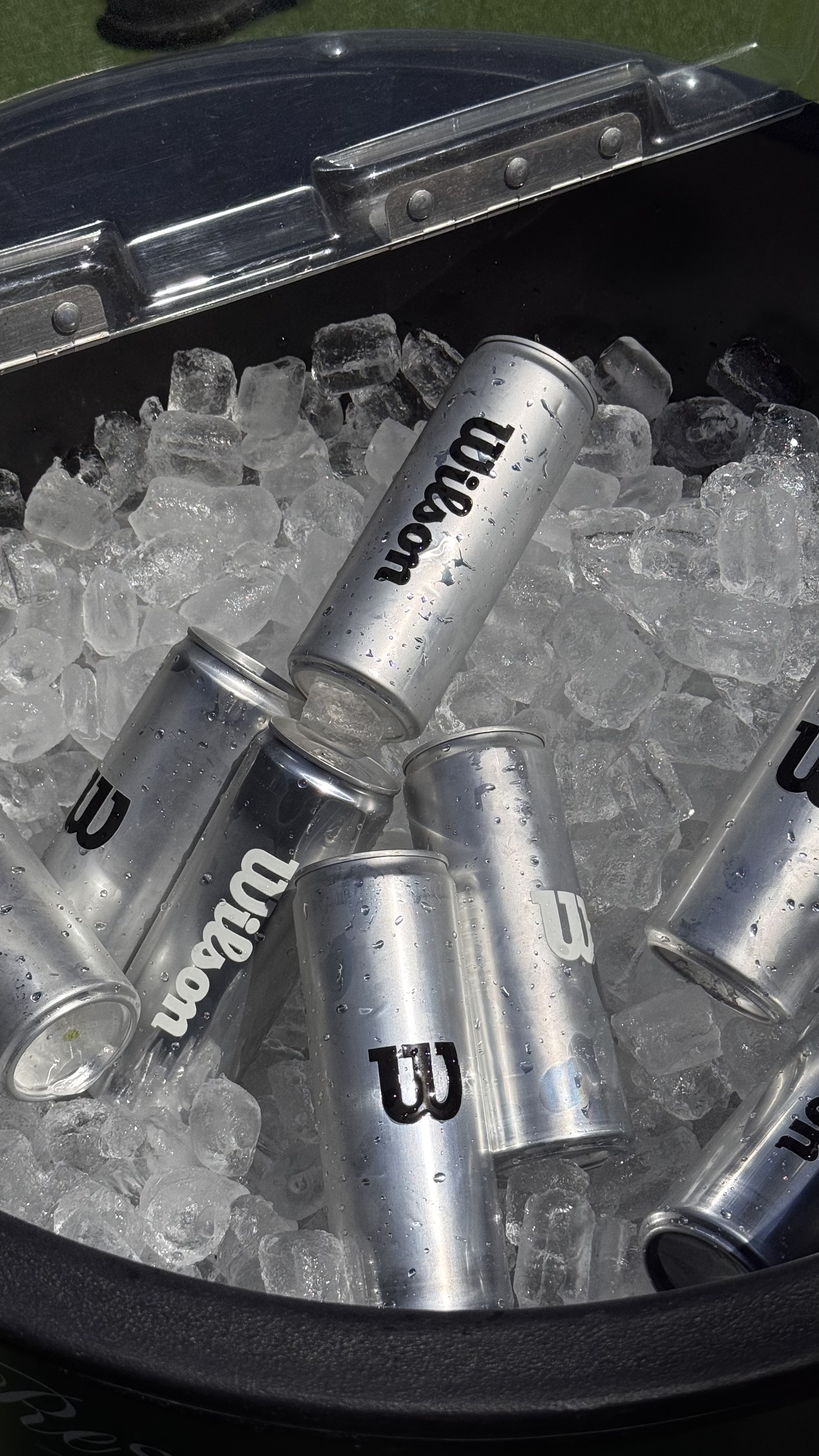 Wilson Tennis custom branded canned water on ice — logo water cans for events