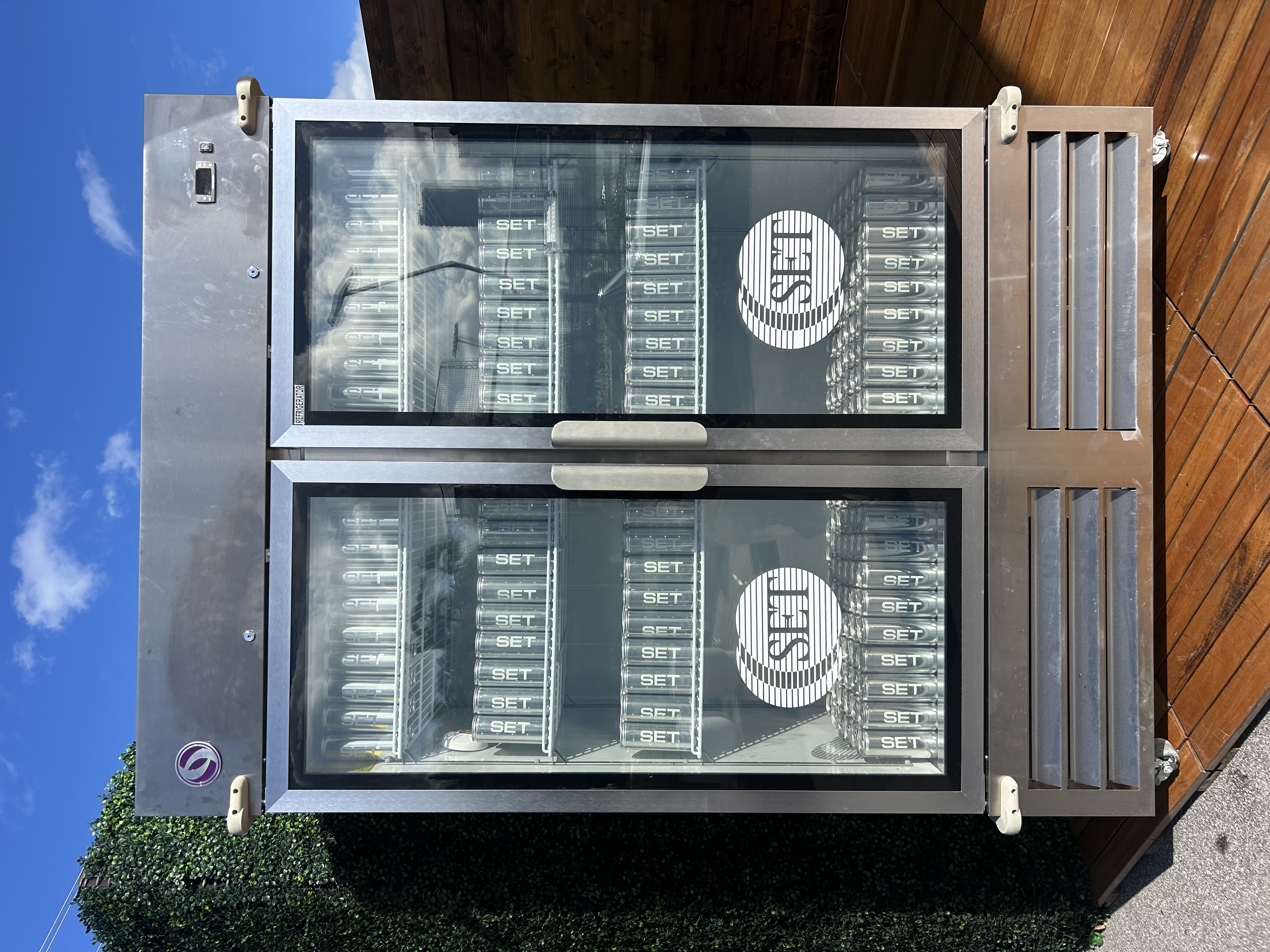 SET Active custom branded canned water in brand activation fridge — event marketing drinks